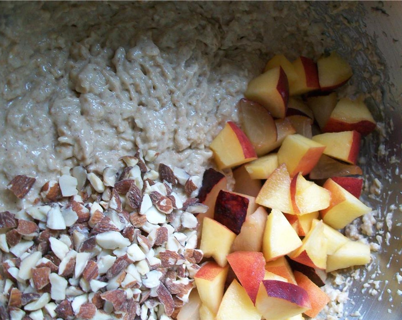 step 7 Pour batter into the prepared pan. Sprinkle with remaining fruit, Old Fashioned Rolled Oats (3 Tbsp) and the handful of almonds.