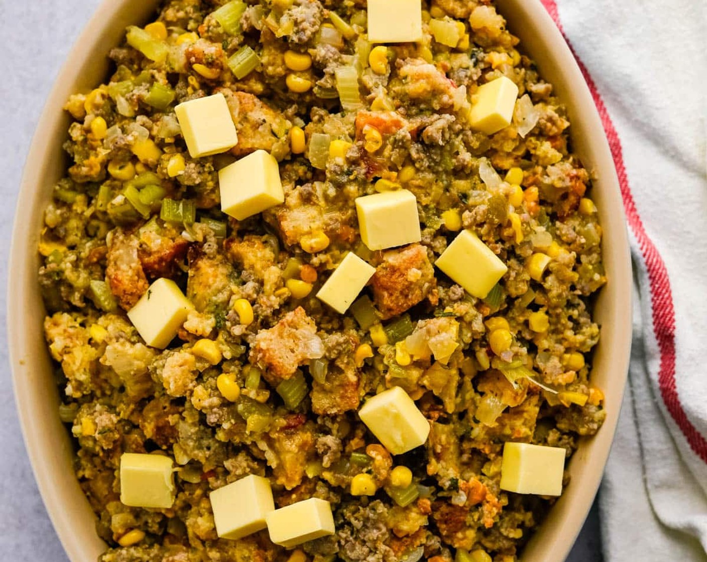 step 9 Spray a 2 quart casserole dish with vegetable spray and transfer the stuffing to the casserole. Dot the top of the stuffing with Butter (2 Tbsp) and bake for 30-35 minutes or until the top of the casserole is hot and crusty.