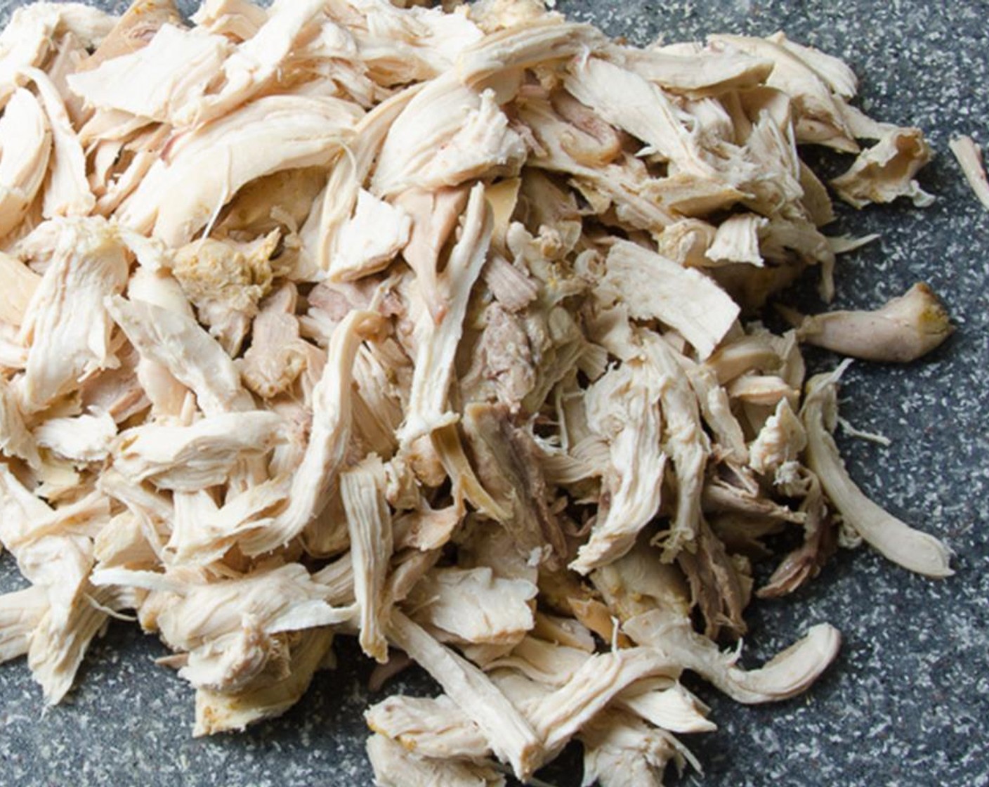 step 9 While vegetables are cooking, remove the meat from the chicken bones, discarding any fat, gristle, skin etc. Shred or cut the meat into bite sized pieces.