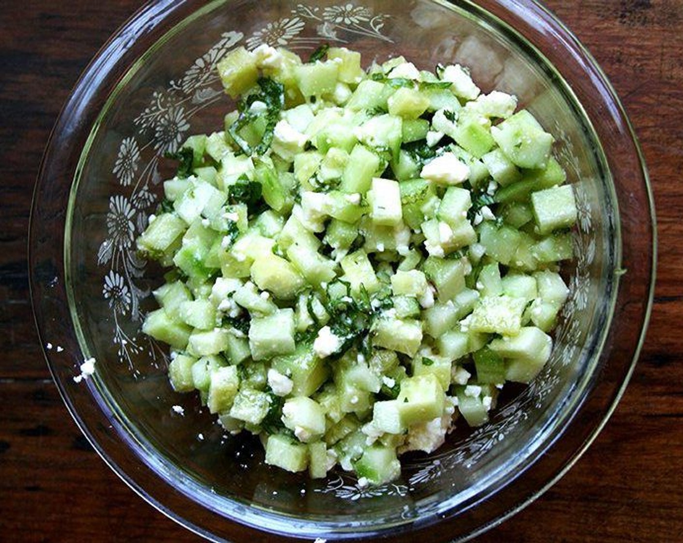 step 7 Add Cucumbers (2 cups), Feta Cheese (to taste), and Fresh Mint (2 Tbsp) in a bowl. Toss with equal parts Extra-Virgin Olive Oil (1 splash) and White Balsamic Vinegar (1 splash). Season with salt if necessary — the feta is salty, so go light to start.