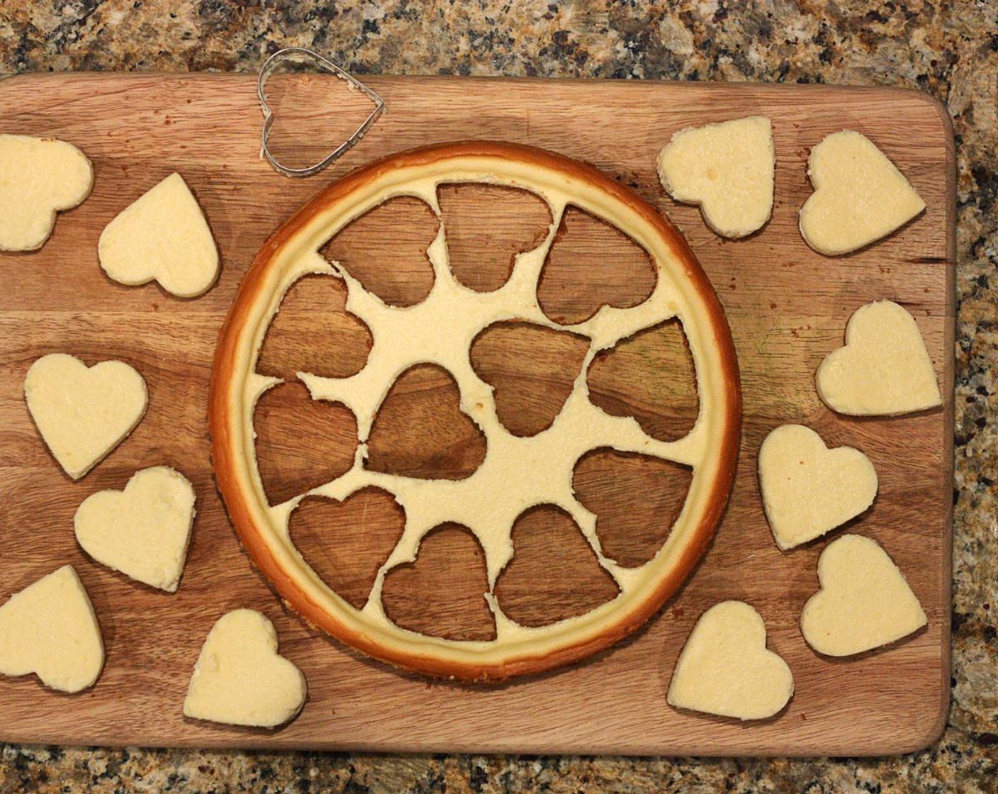 step 14 For shaped bars, use a cookie cutter (as deep as you can find!) to press all the way through the cheesecake. You may need to use a knife or flat spatula to get the cheesecake out of the cookie cutter.