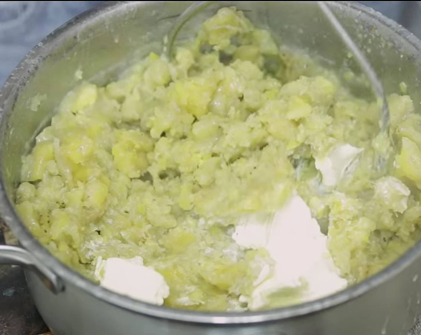 step 7 Drain plantains leaving a little bit of the cooking water behind, mash them with a potato masher or a drinking cup, preferably plastic or aluminum. Once mashed mix in Butter (1/3 cup) and continue mashing until smooth, some lumps are ok!