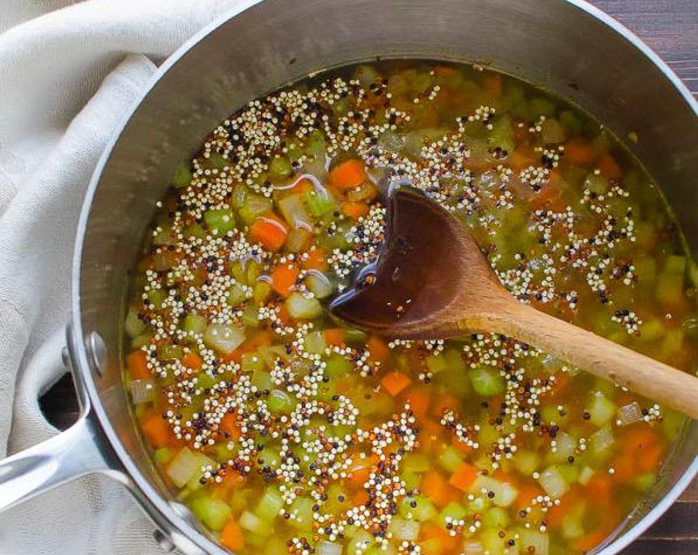 step 3 While lentils are cooking, heat Olive Oil (1 Tbsp) in a medium saucepan over medium heat. Add diced celery, carrots, and onion. Cook until slightly softened, 4-5 minutes. Add Quinoa (3/4 cup) and Water (1 1/2 cups) and bring to boil.