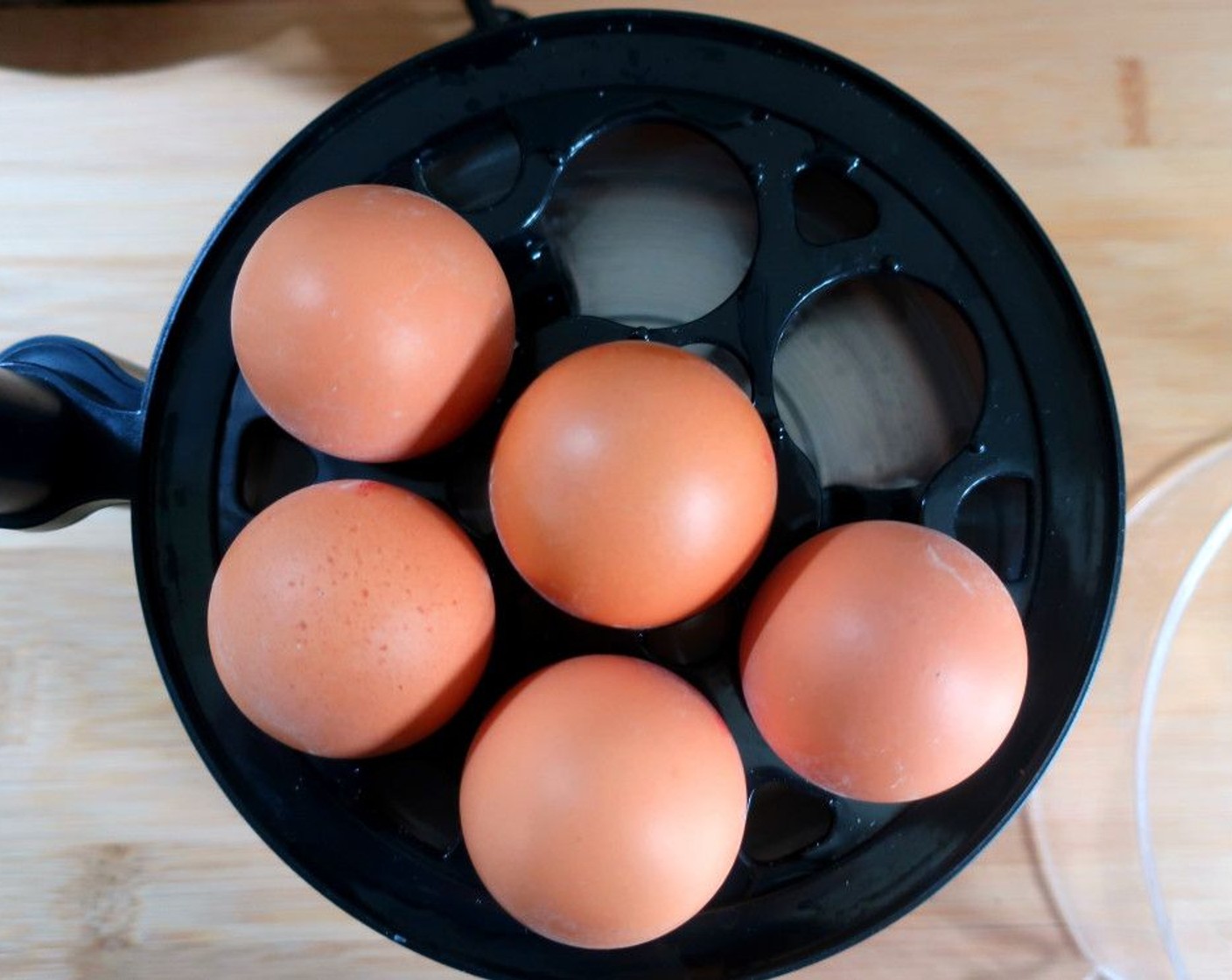 step 1 Instead of boiling the Eggs (5) covered in water, steam them in an egg cooker or Chinese steamer; the steam lets you peel the soft eggs easier without breaking them. However, if you don't have a steamer you can just boil them. Cooking for 6 minutes should give you a soft-boiled egg, 6 1/2 for a slightly firmer but still "jammy" center.