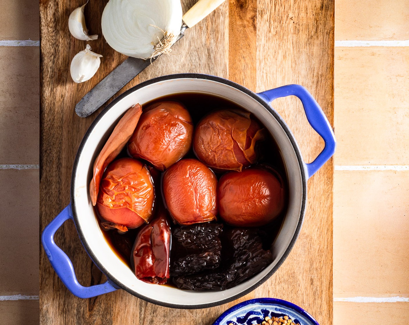 step 4 In a medium pot set over medium heat, add the whole Roma Tomatoes (5), the toasted and de-seeded chiles, and Water (2 cups). Boil until the tomatoes are soft and the chiles have hydrated completely about 10 minutes.