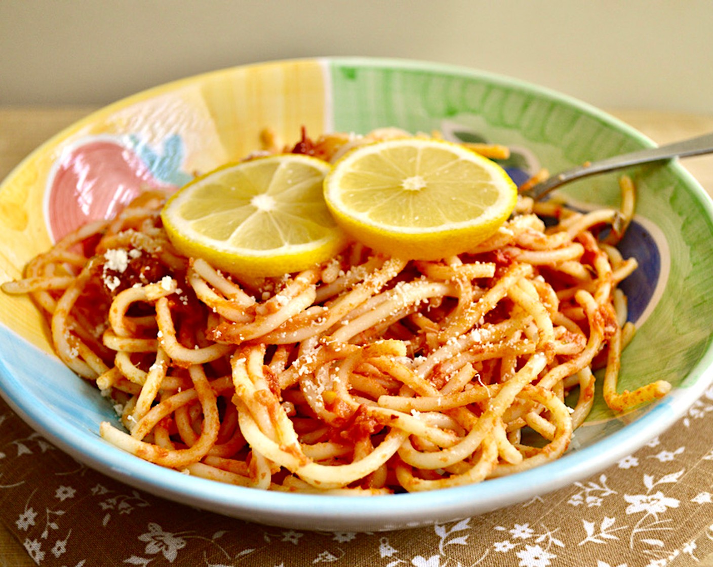 step 7 Plate pasta, sprinkle with parmesan and garnish with lemon slices.