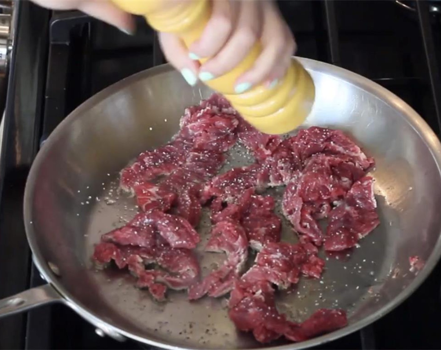 step 7 In a large pan or wok, heat some Vegetable Oil (as needed) on high. Sear the meat in 2 or 3 batches, so that you don’t overcrowd the pan (it won't sear properly). Season with Salt (to taste) and Ground Black Pepper (to taste). Cook for about 2 minutes total, or just until browned and almost cooked through. Set aside.