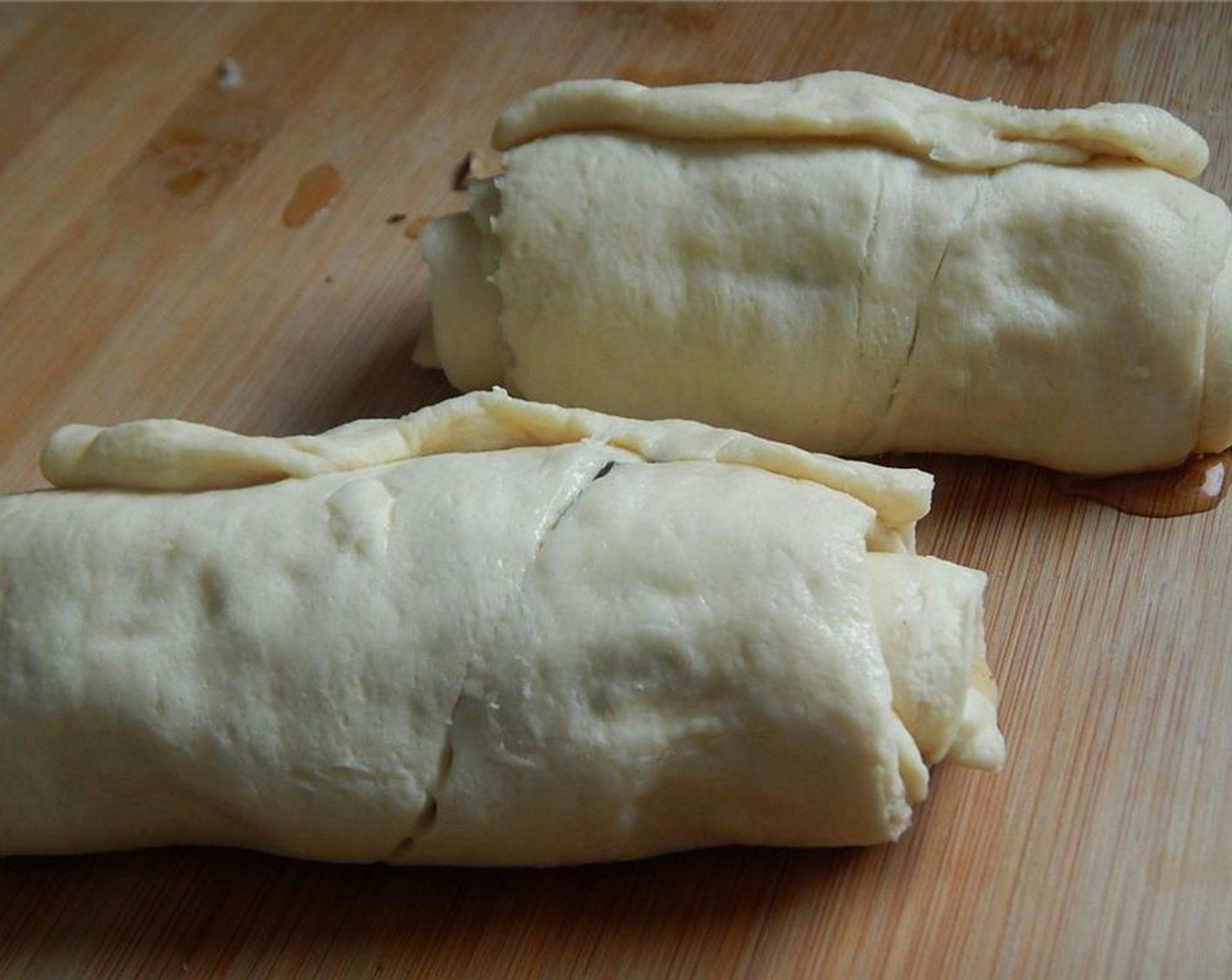 step 5 Roll up and pinch the ends shut. Place in freezer for 5 to10 minutes to firm up a little, this will help when you cut them.