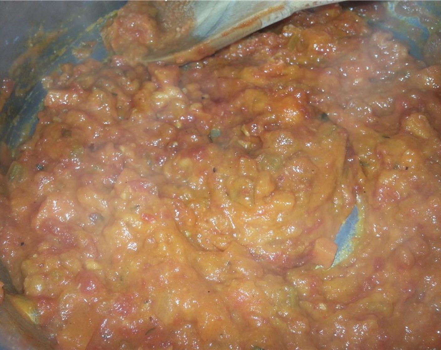 step 15 Add in tomato sauce and stir to combine over medium heat.