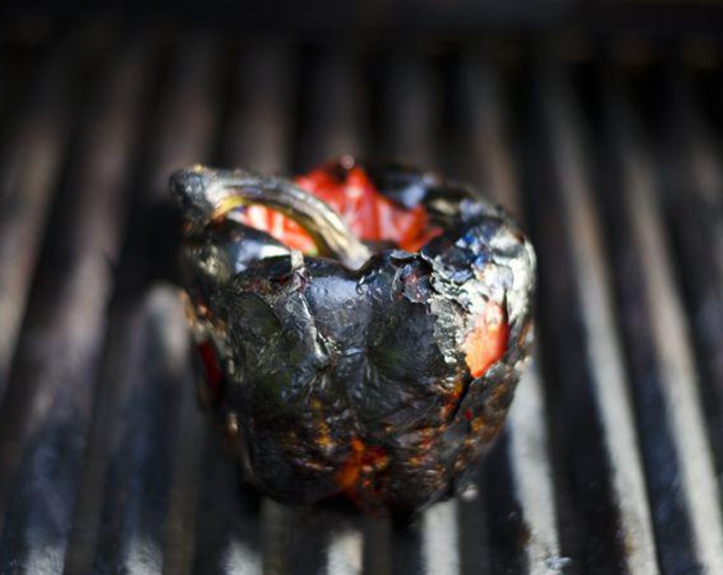 step 2 Place Red Bell Pepper (1) directly onto grill. Cook 10-20 minutes, rotating often, until outside is blackened.