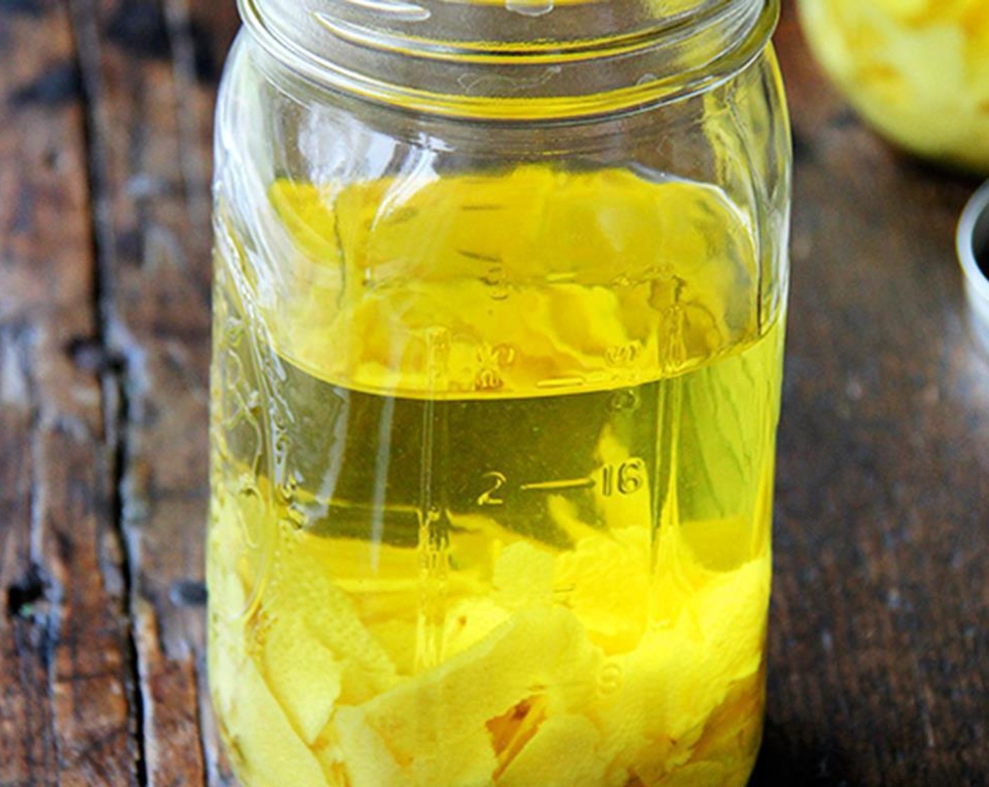 step 2 Place the zest in one or two large glass mason jars and pour Vodka (1 bottle) evenly over top.