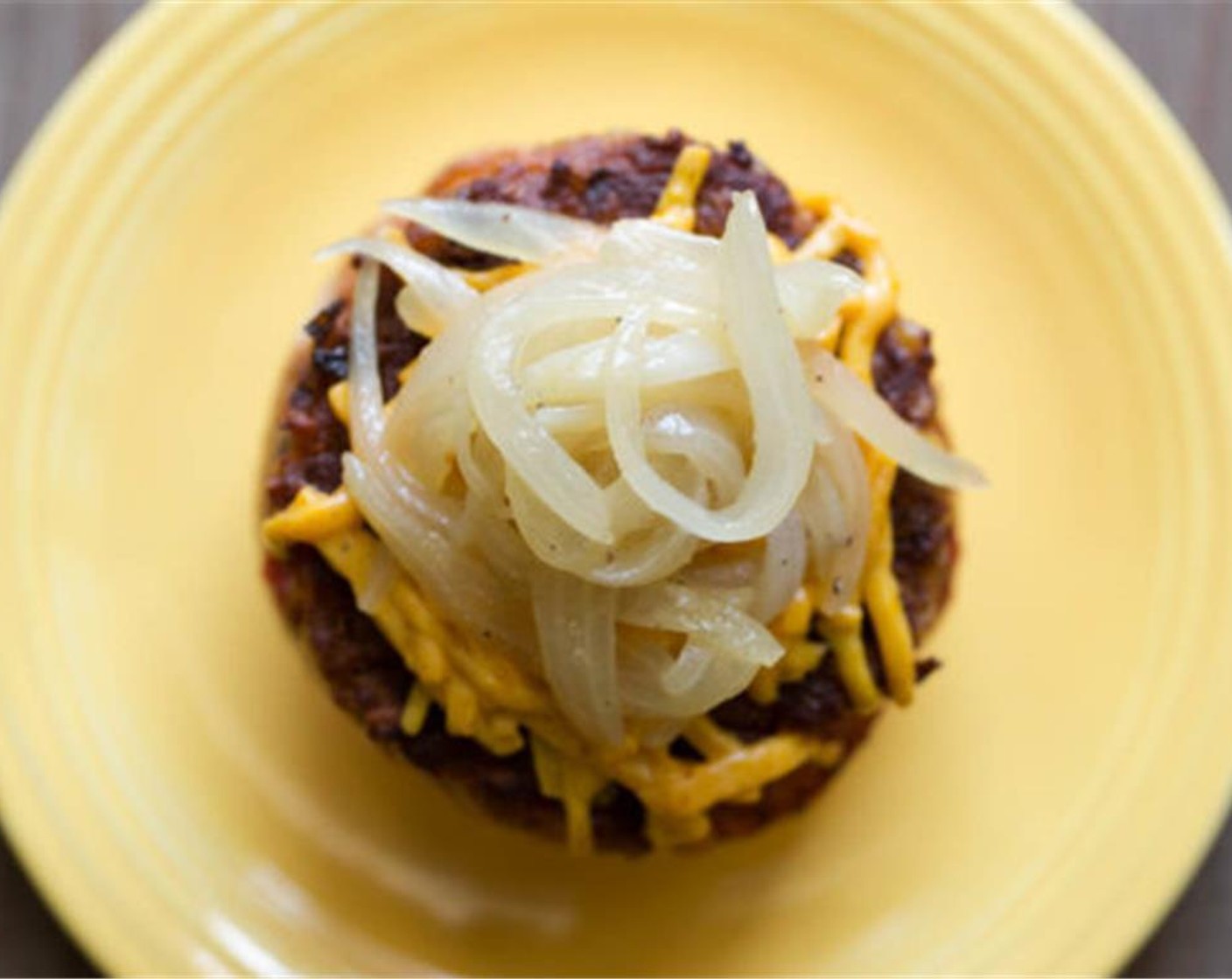 step 13 Spread both sides of Hamburger Buns (8) with your Homemade Ketchup and place a layer of mushrooms on the bottom bun. Place the cheese burger on top of the mushrooms. Top with caramelized onions and serve hot immediately.