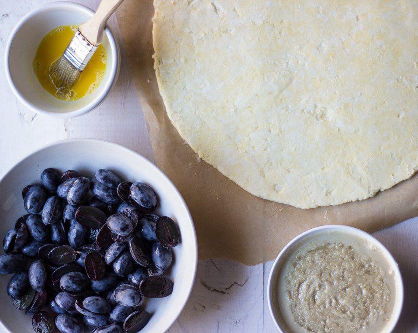 step 3 Roll out Pie Crust (1) into a 11 inch round and place on a baking sheet lined with parchment.