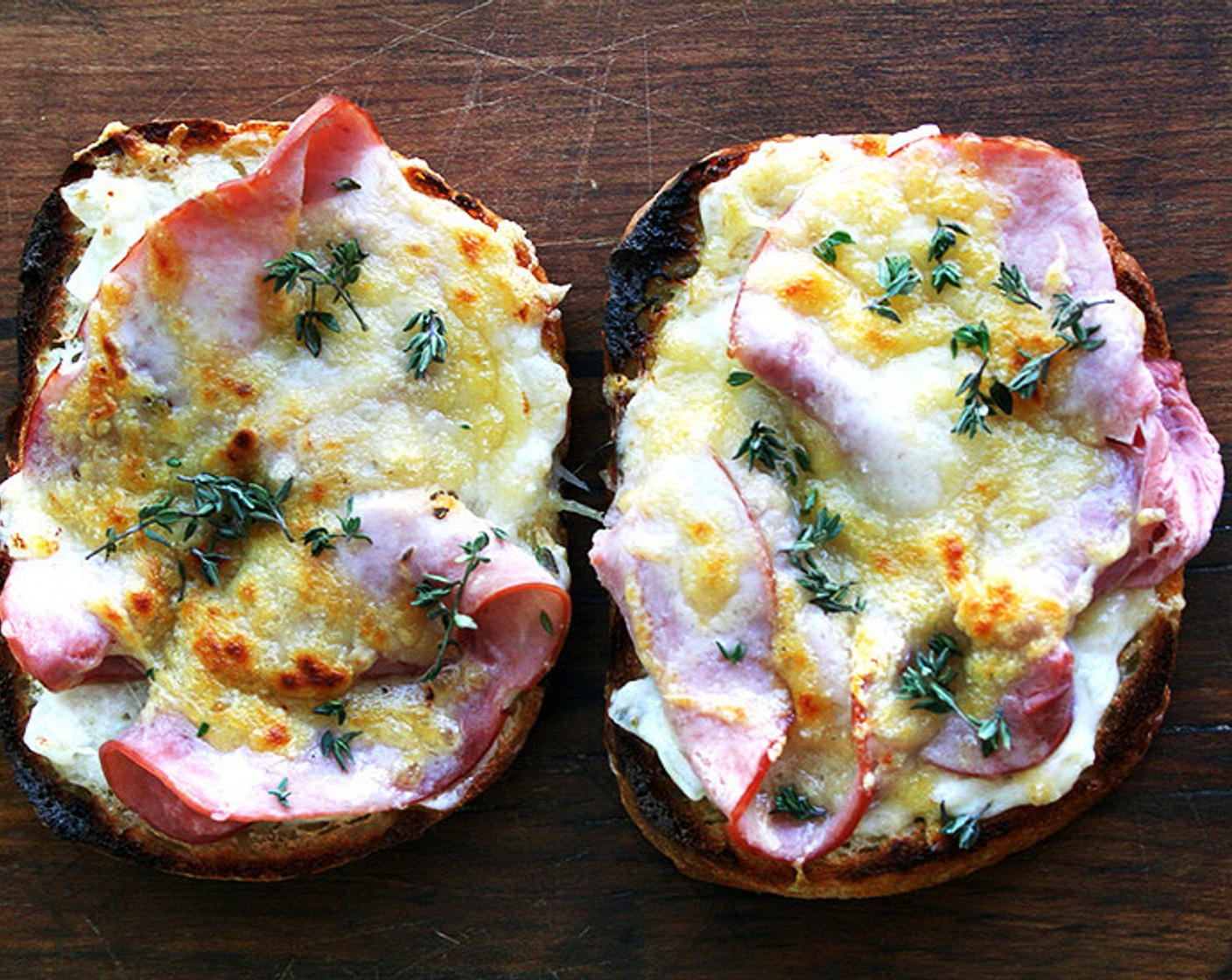 step 12 When the eggs have cooked for 3 minutes, place the toasts under the broiler and cook until the cheese is bubbling and starting to brown. Remove from the oven. Sprinkle with the Fresh Thyme Leaves (to taste).