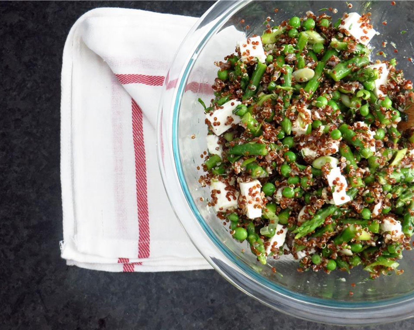 step 7 In a medium bowl, combine the Green Peas (1 cup), asparagus, quinoa, scallions, and feta cheese. Toss with dressing and serve. Enjoy!