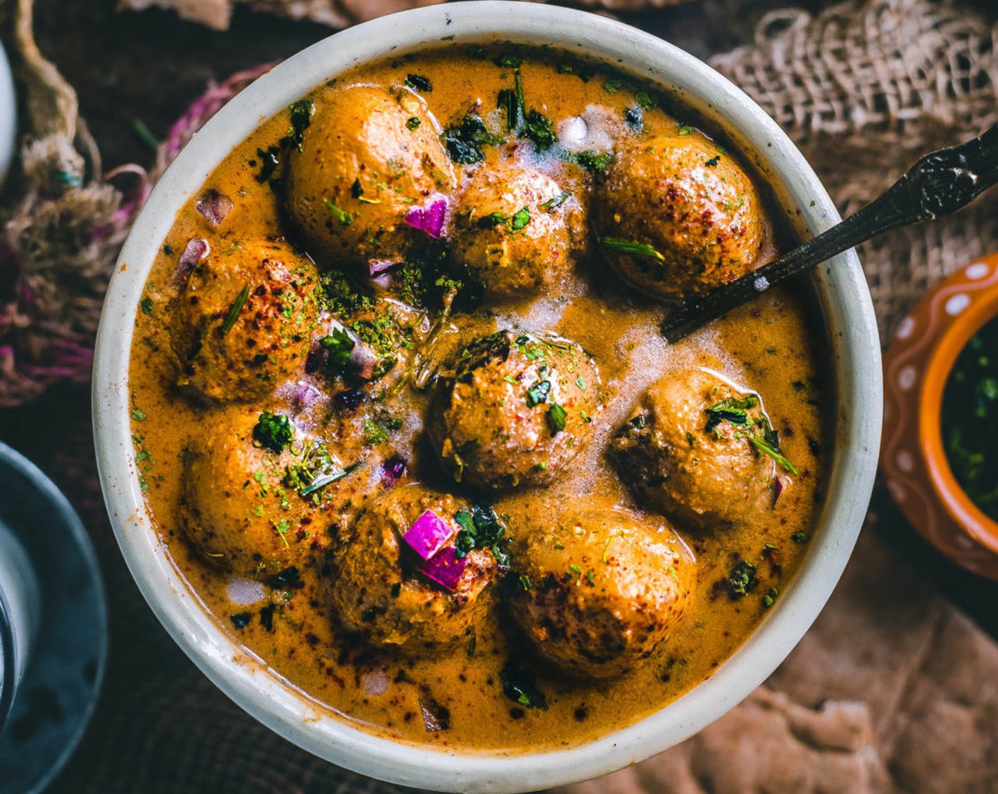 step 15 Garnish with Fresh Cilantro (2 Tbsp) and some Kasuri methi, then take it off the flame. You can also squeeze lemon juice on top. Serve this delicious Dum Aloo warm with some Indian bread like naan, roti, chapati, puri, or even bhakri.