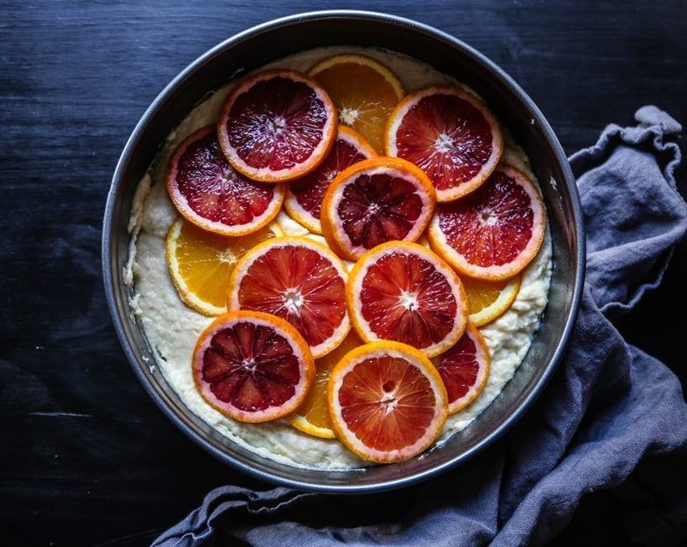 step 4 Once combined, pour the batter into cake pan. Place Blood Oranges (3) on top and bake for about 45 to 50 minutes or until golden brown.