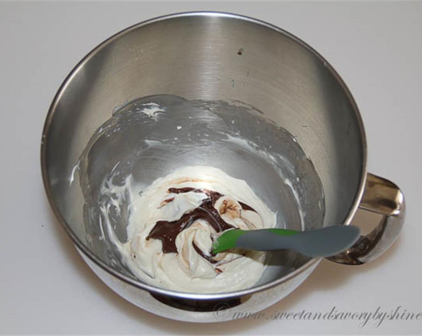step 2 In a mixing bowl with a whisk attachment, beat the Cream Cheese (1/2 cup), Sweetened Condensed Milk (1/4 cup) and Vanilla Extract (1/2 tsp) together until well combined. Swirl Nutella® (2 Tbsp) in to bowl to mix throughout.