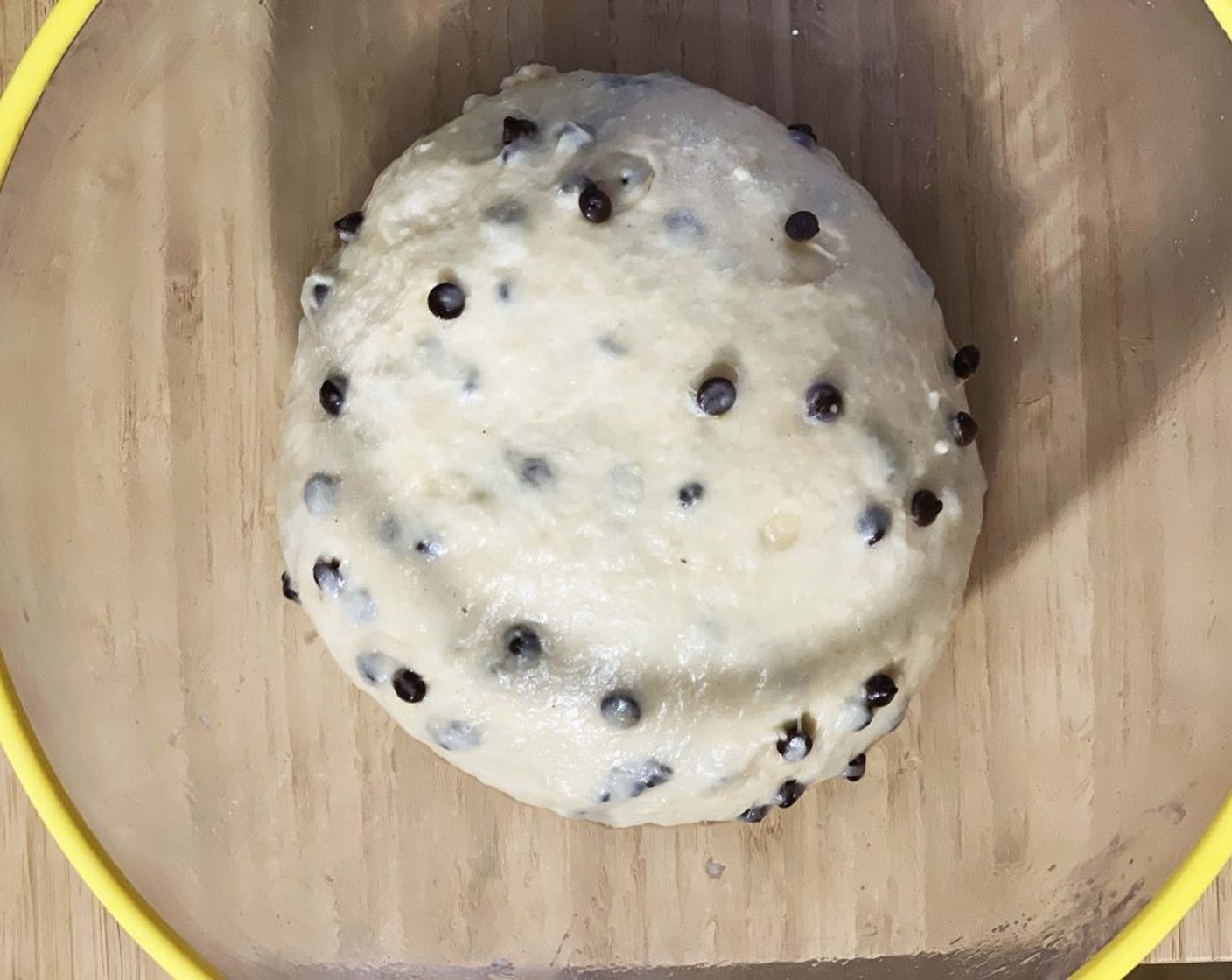 step 6 Lay the dough now in a lightly oiled bowl, cover with plastic wrap and let it rest at room temperature until it doubles in size, about 3 hours.