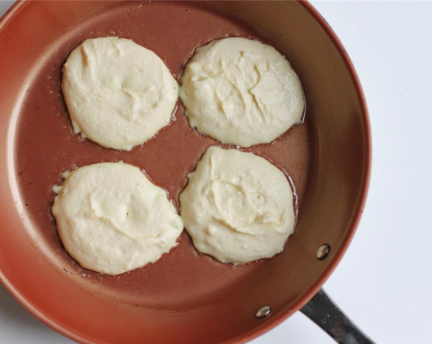 step 4 Put Coconut Oil (2 Tbsp) or more into a frying pan and bring to low heat. Scoop 1/4 cup of batter and pour onto frying pan.