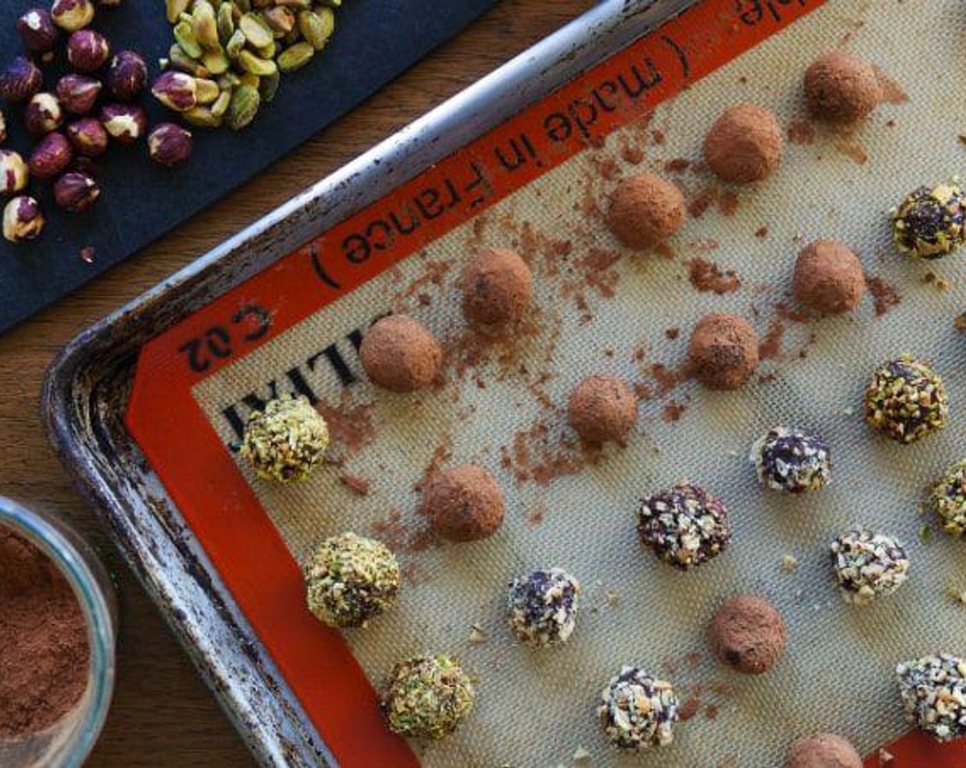 step 4 Roll the chocolate into 1-tablespoon size balls. Immediately roll in the Pistachios (to taste), Hazelnuts (to taste), or Coconuts (to taste). If you wait, the nuts won't stick as well.