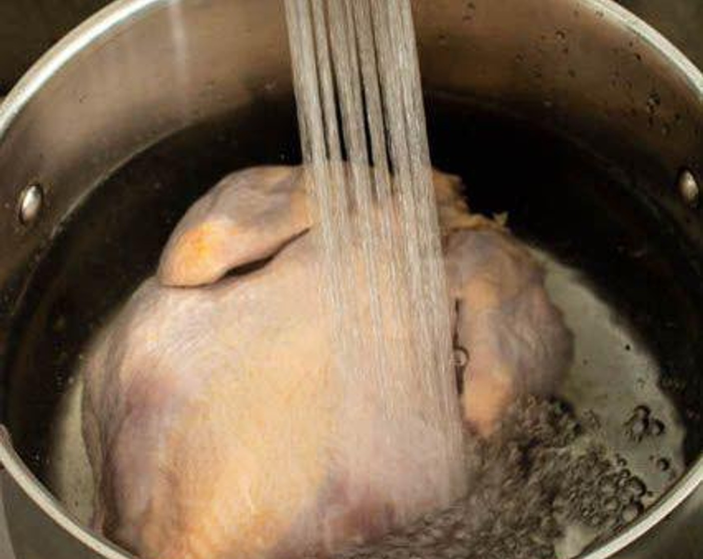 step 1 Place the Whole Chicken (1) in a stockpot, then fill the pot with just enough Water (12 cups) to cover the chicken.