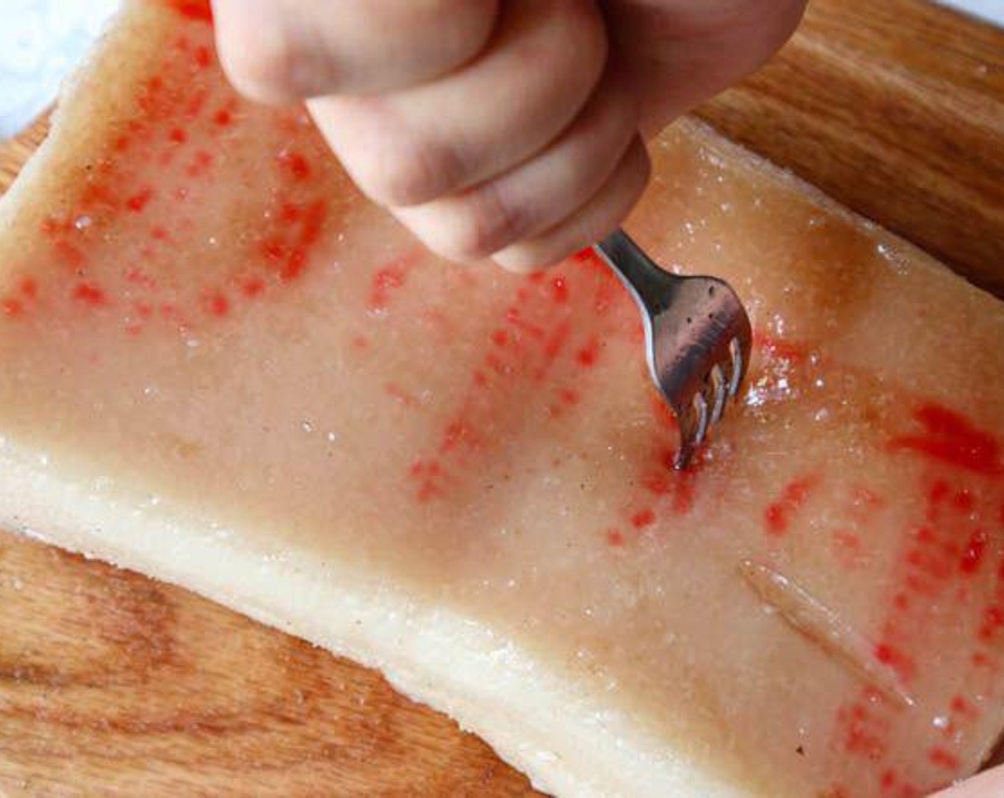 step 4 Transfer the pork out and pat dry the water. Then, poke as many holes on the rind. Back and forth and repeat several times. This is the most important step.