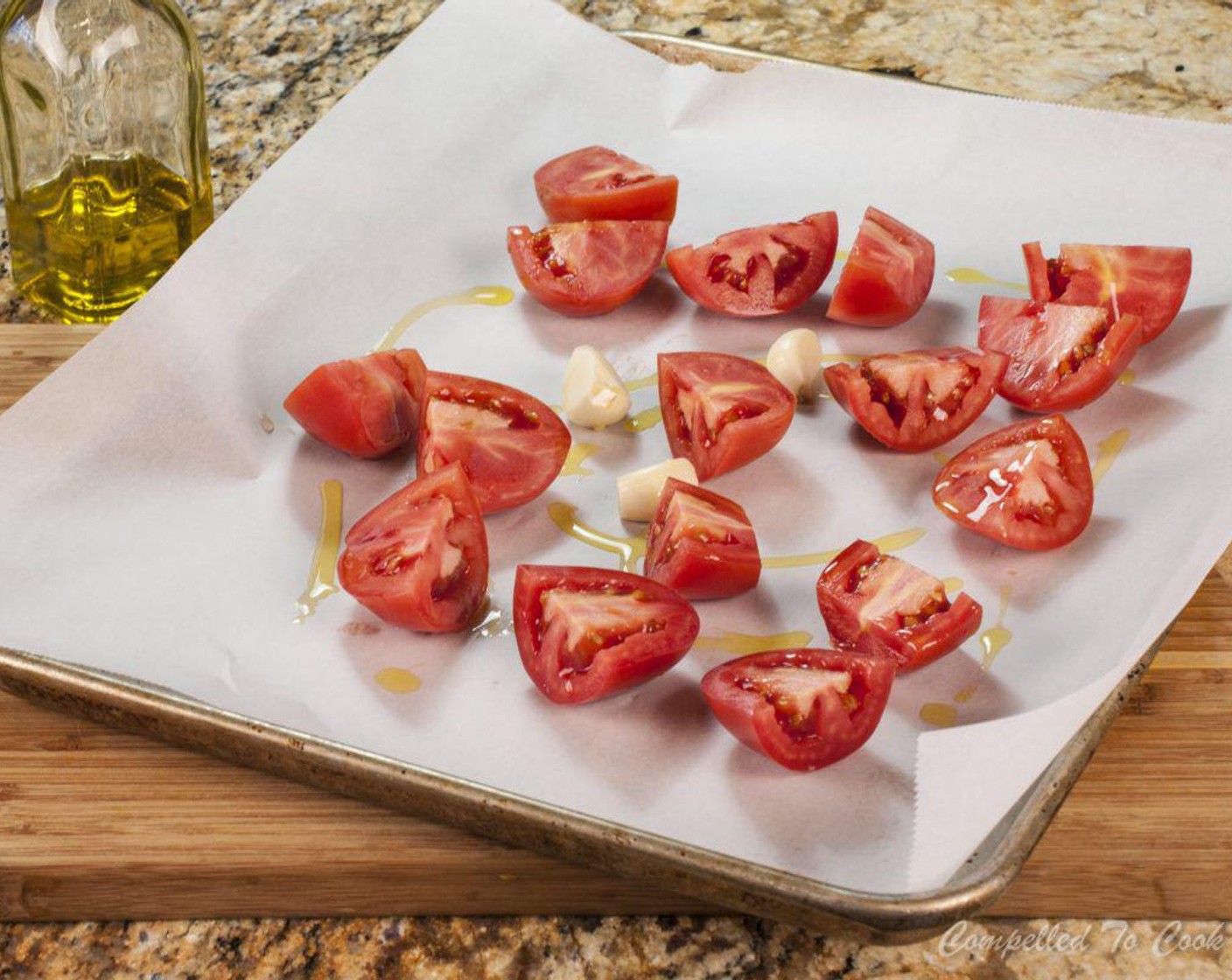 step 6 Spread out on a parchment lined baking sheet. Drizzle the pumpkin and tomatoes with Olive Oil (4 Tbsp) and roast in preheated oven for 1 1/2 hours. Add Garlic (2 cloves) to the tray during the last 1/2 hour.