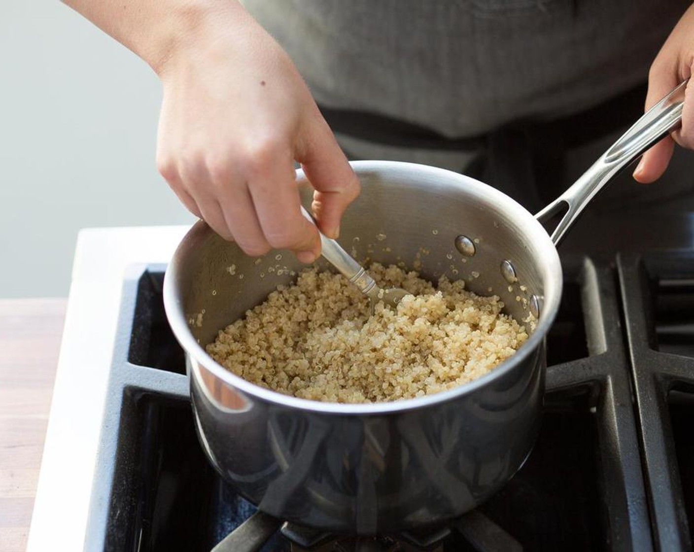 step 1 In a small sauce pot over medium-high heat, bring some Water (1 1/2 cups) to a boil. Add the Quinoa (2/3 cup) and return to a boil. Reduce heat to low, cover and let simmer for 30 minutes. Remove from heat, fluff with a fork and keep warm.