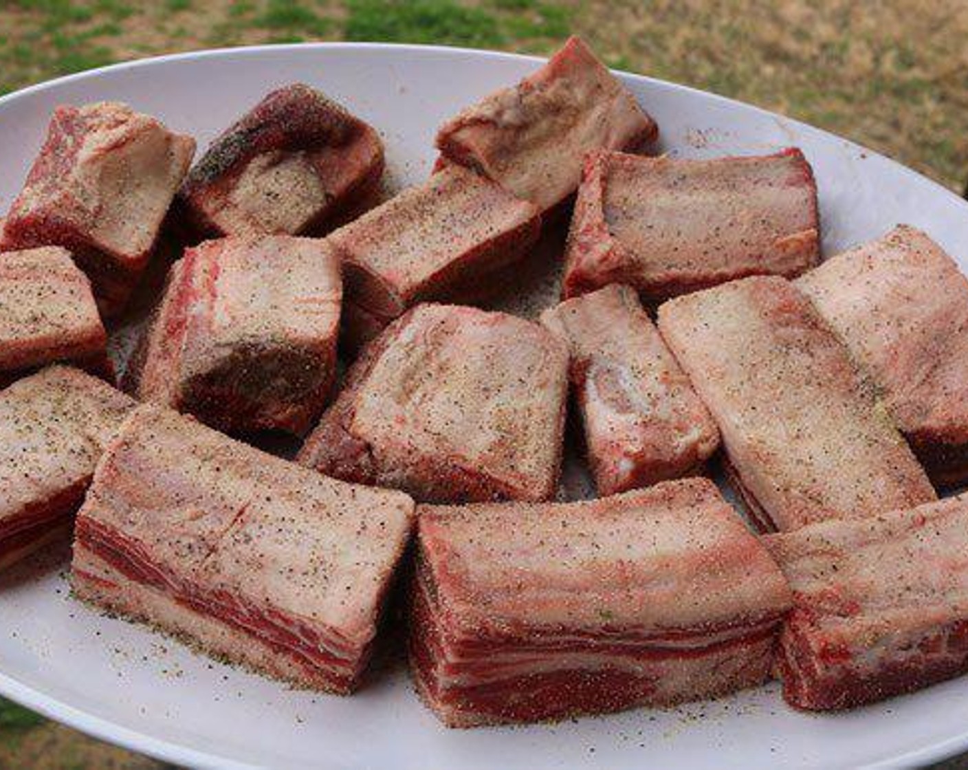 step 2 Season outside of Beef Short Ribs (12) with All-Purpose Spice Rub (1/2 Tbsp). Place on pit and smoke for 3 hrs until brown on all sides.