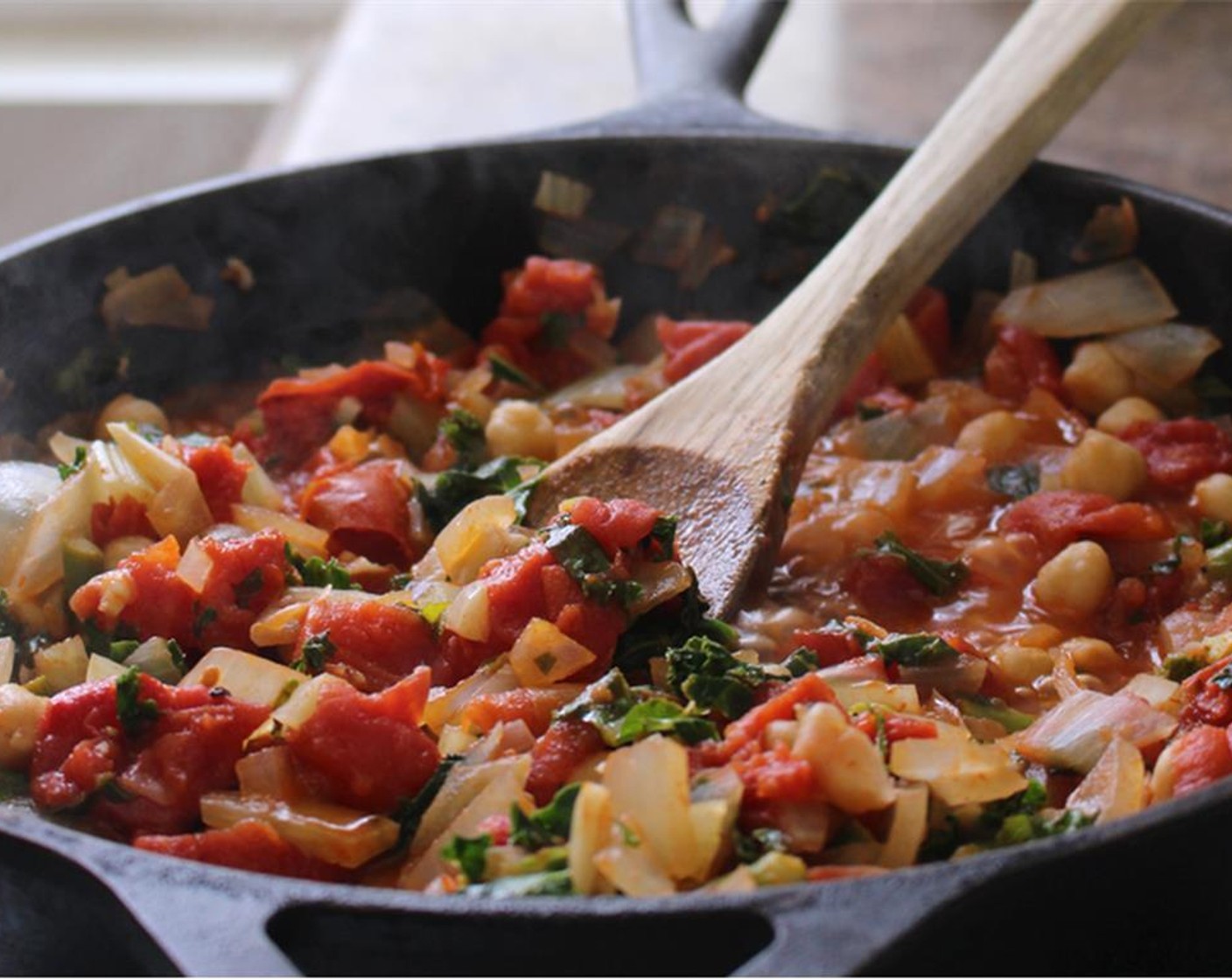 step 3 Cook for 10 to 15 minutes, stirring occasionally. Taste and adjust seasoning if desired. Turn the heat down to low and make a small well for each egg.