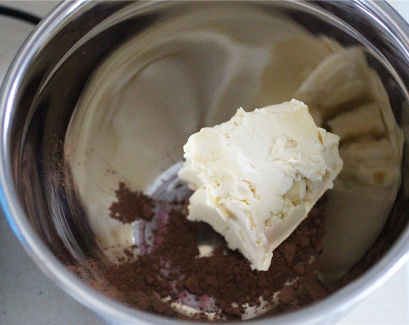 step 7 Melt the Dark Chocolate (2 Tbsp) in a small bowl, and set aside. In a medium bowl, beat together Buttery Spread (1 cup) and Unsweetened Cocoa Powder (1 Tbsp).