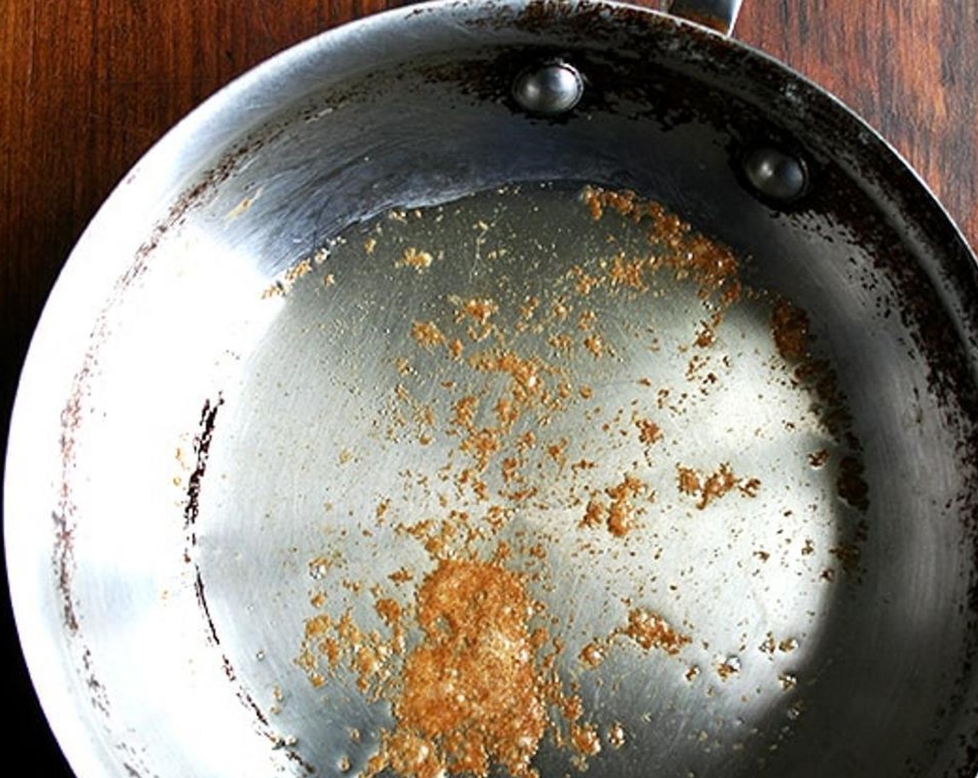 step 4 For the orzo, in a large skillet or a medium heavy saucepan, cook the Unsalted Butter (1 Tbsp) over moderately low heat until the solids that sink to the bottom are golden brown and the butter smells like roasting nuts.