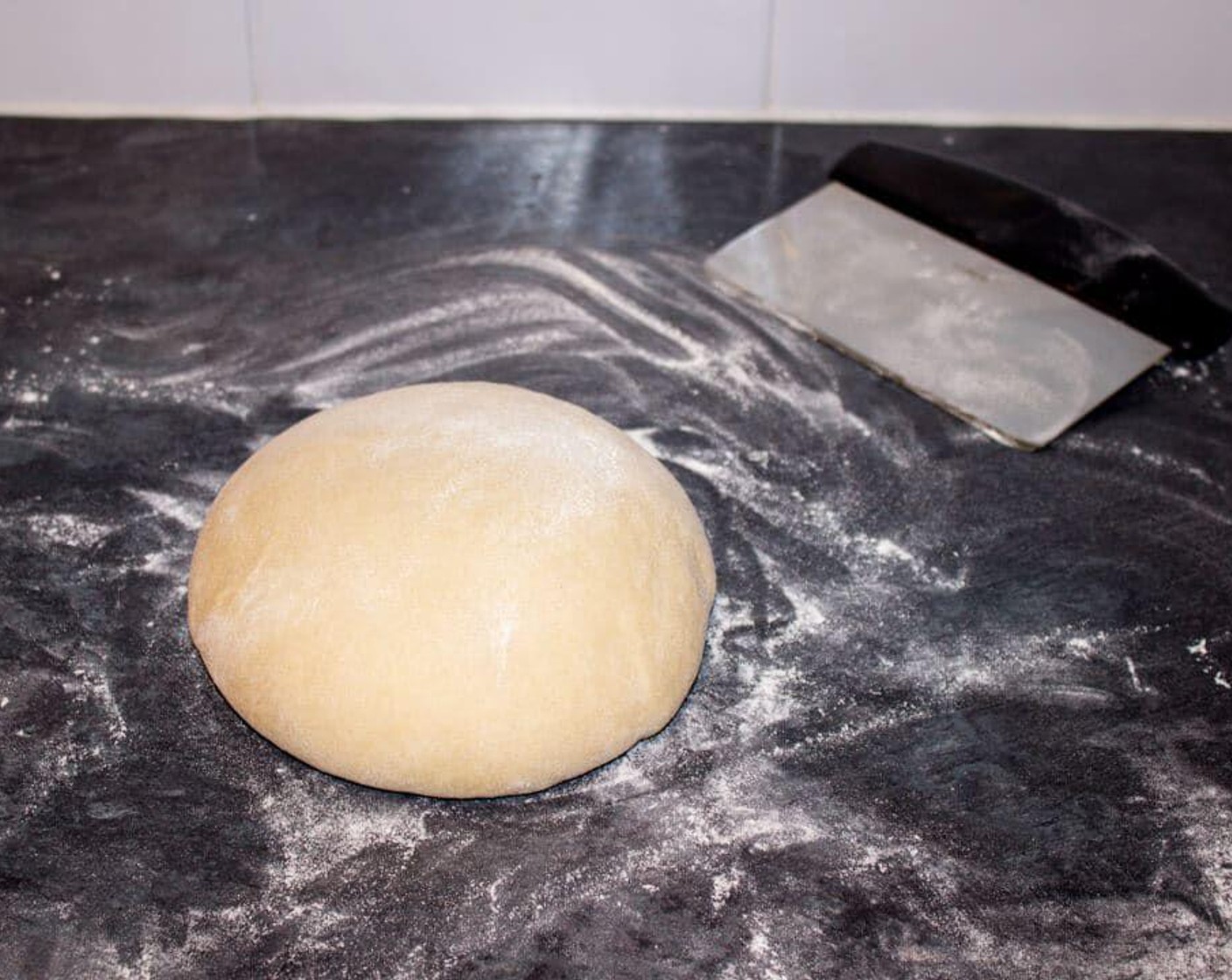 step 4 Tip the dough out onto a lightly floured surface and shape into a ball. Dust it all over with flour then place into a large plastic bag. Chill in the fridge for 1 hour.