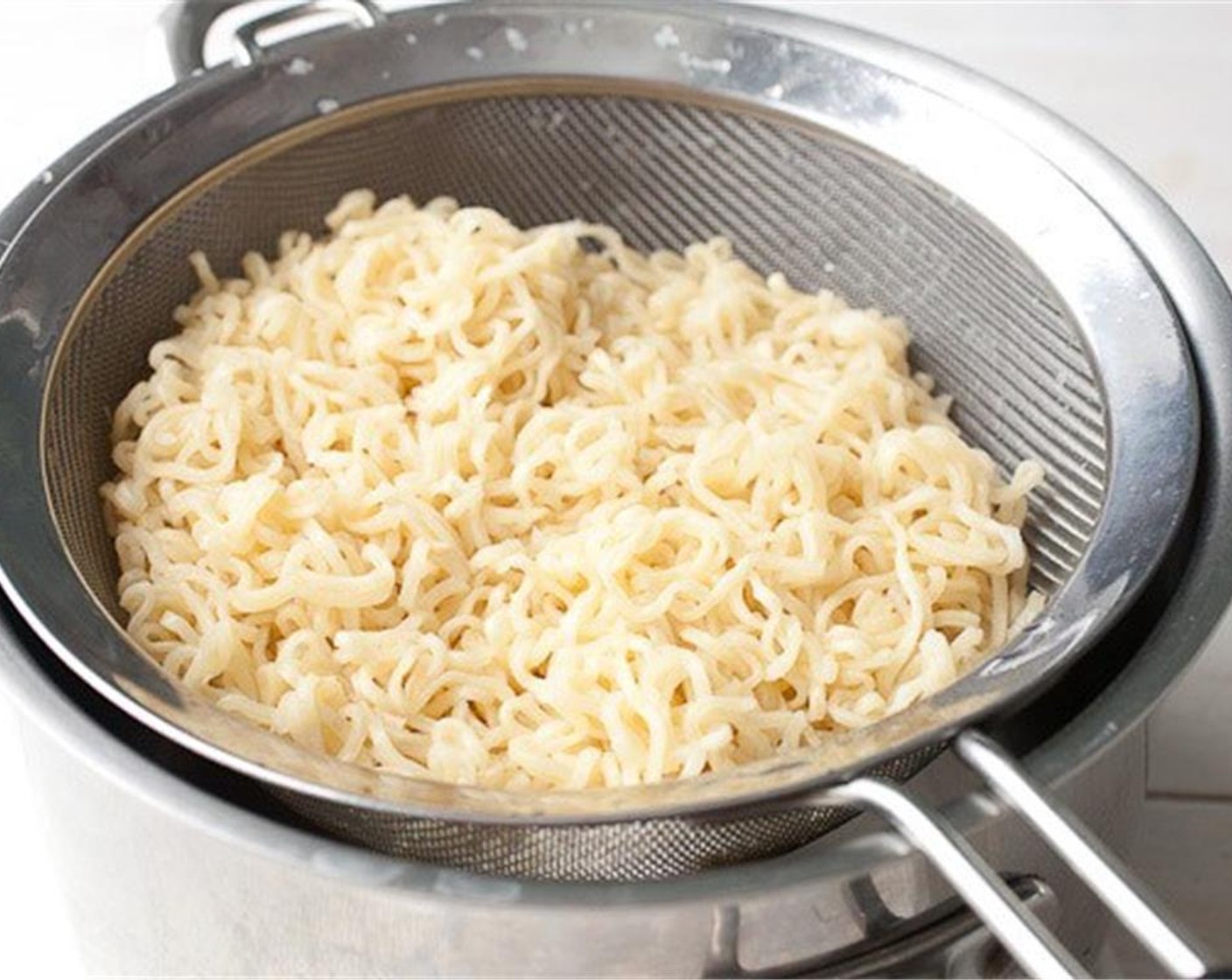 step 1 Cook the Ramen Noodles (3 pckg) and drain and rinse them in cold water. Save the ramen spice packets.