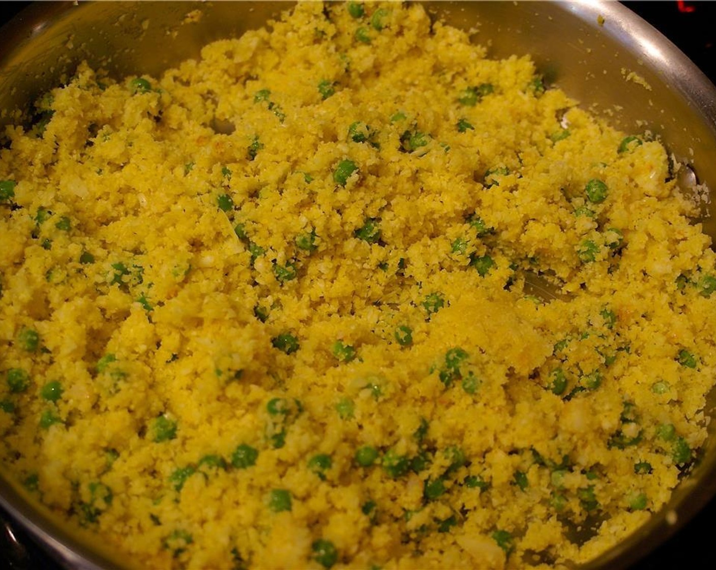 step 6 Add Ground Turmeric (1/2 tsp), Green Peas (1 cup), and 2 tsp zest from the Lemon (1), stirring well. When the peas are heated through, remove from the heat.