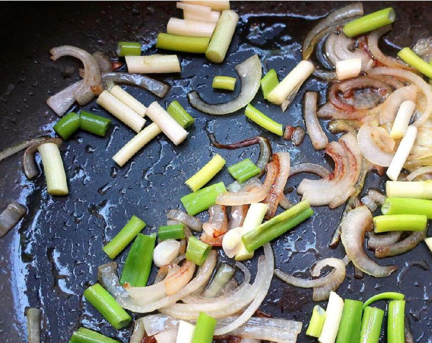 step 1 In Olive Oil (1 Tbsp), saute Scallions (6 stalks) and Onion (1) until onions are lightly caramelized, turn down the heat of the pan to low.