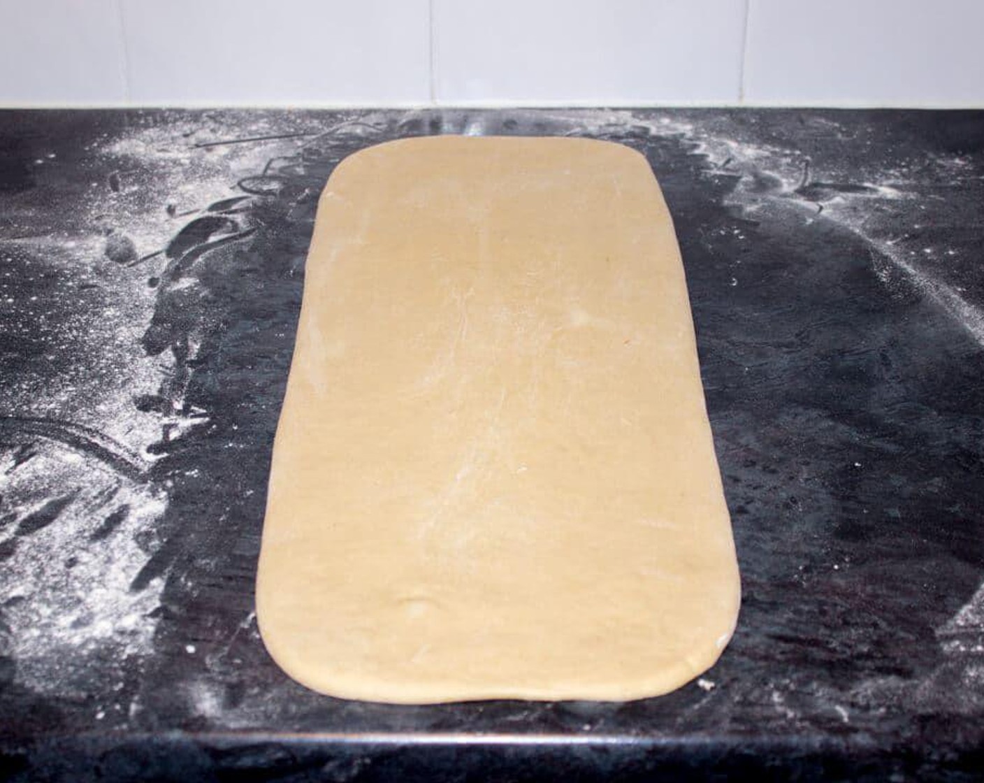 step 6 Once the hour is up, take the dough out of the fridge and roll to a rectangle measuring approx 50 x 20 cm and 1cm thick.