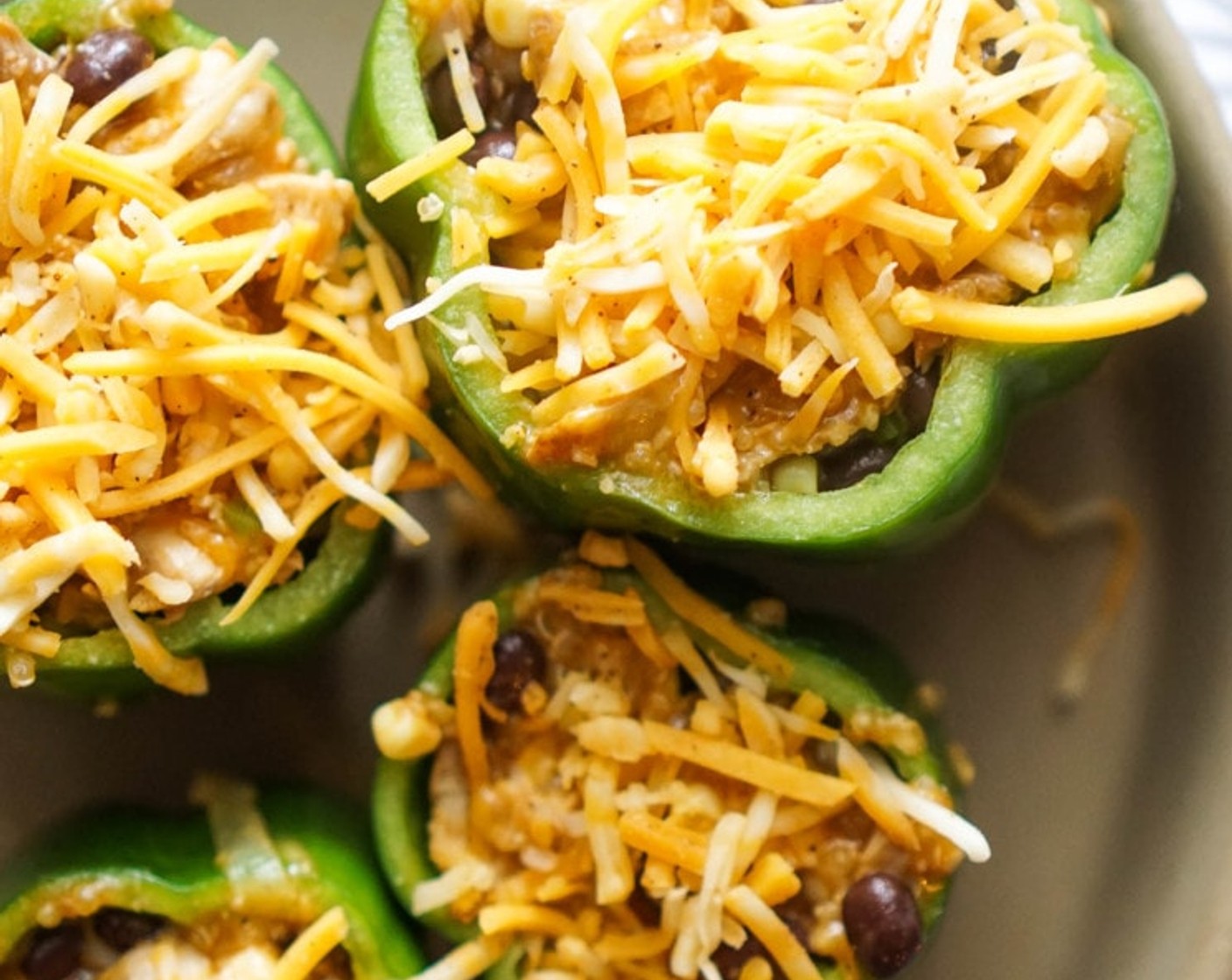 step 12 Add Shredded Cheddar Cheese (1 1/2 cups) and mix until melted and combined. Stuff the mix inside each pepper just until the pepper is full. Snug the peppers next to each other, using the peppers as support to stand, in your baking dish. Sprinkle the tops with the remaining cheese.