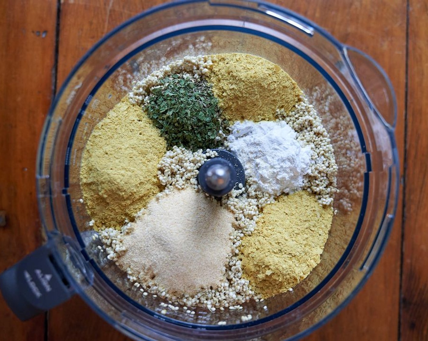 step 3 Add the quinoa, Water (1 cup), the Baking Powder (1 Tbsp), Simply Organic Garlic Powder (2 Tbsp), Italian Seasoning (2 Tbsp), Sea Salt (1 tsp) and Nutritional Yeast (4 Tbsp) to a food processor. Blend until a smooth batter forms.