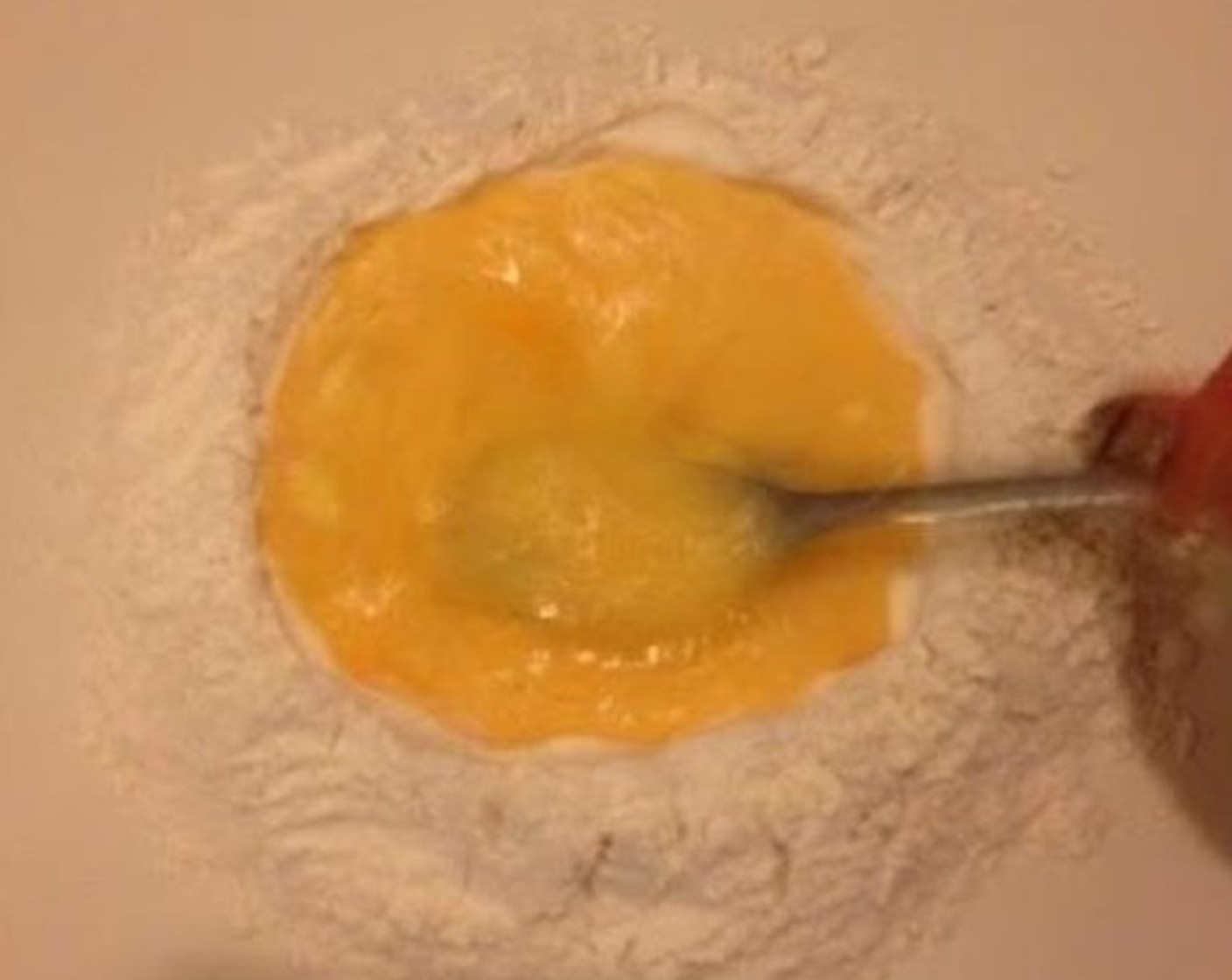 step 3 Crack the Farmhouse Eggs® Large Brown Eggs (3) into the flour bowl and whisk with a fork.