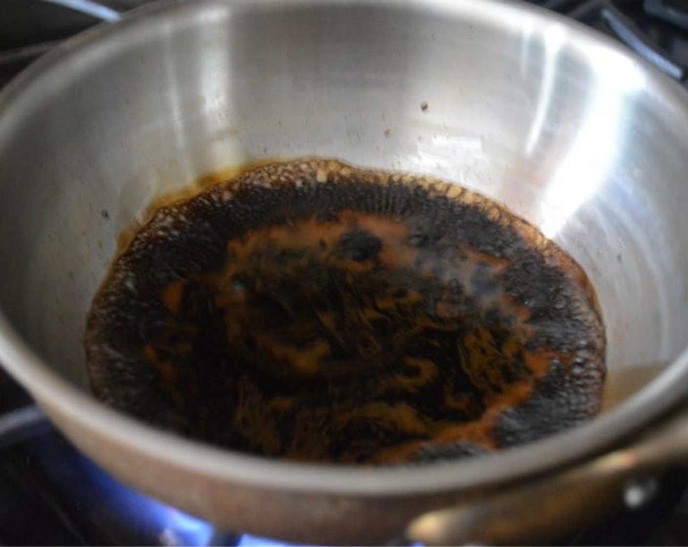 step 5 Meanwhile, make the balsamic reduction. In a small pot, bring the Balsamic Vinegar (1/2 cup) to a gentle boil over medium heat on the stove. Let it reduce by half into a thicker syrup. Take it off of the heat and set it aside.