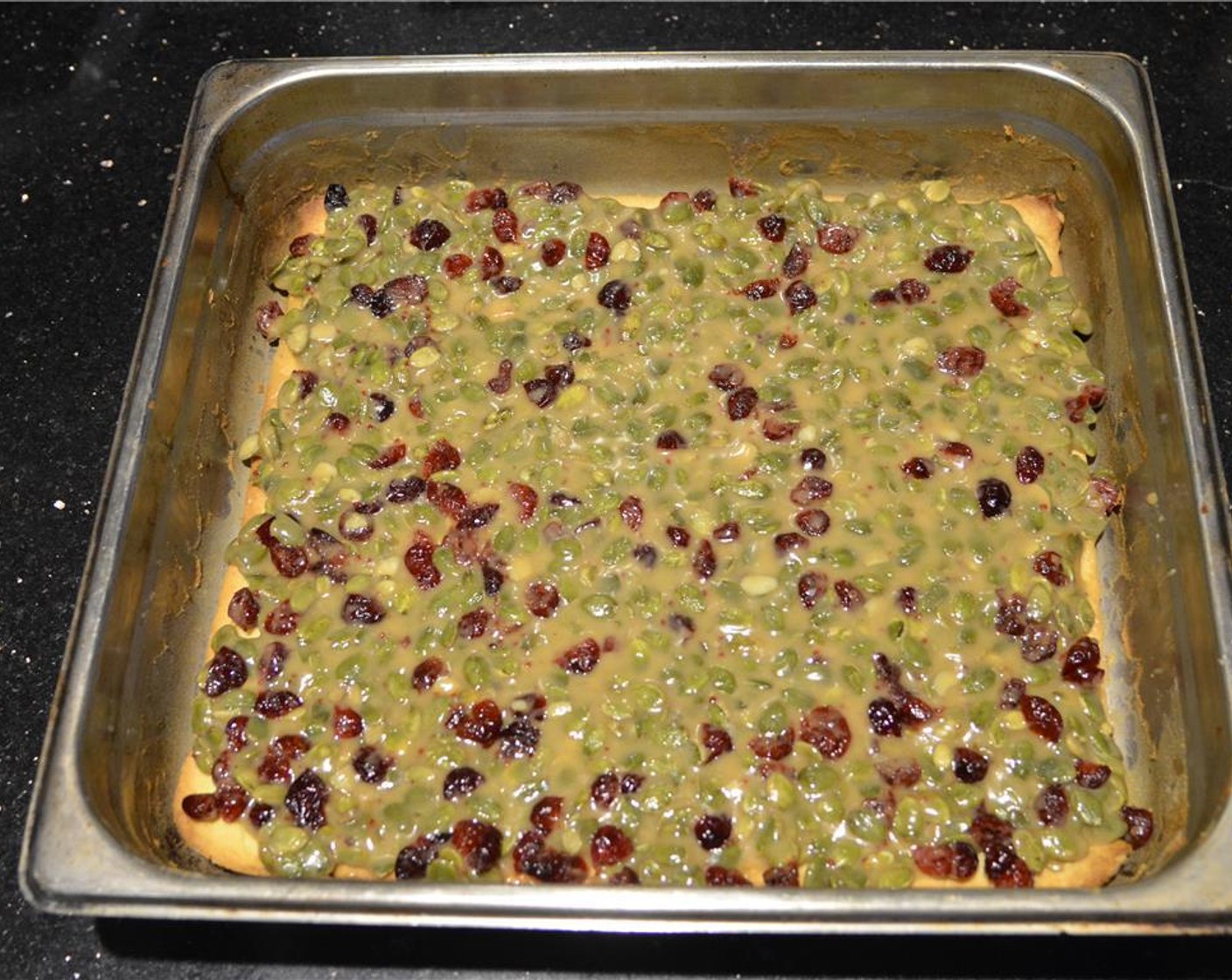 step 11 Working quickly before the caramel cools, spread the topping over the cookie dough into an even layer. Place in the oven, then lower the oven temperature to 170 degrees C (340 degrees F) and bake for 15 minutes.