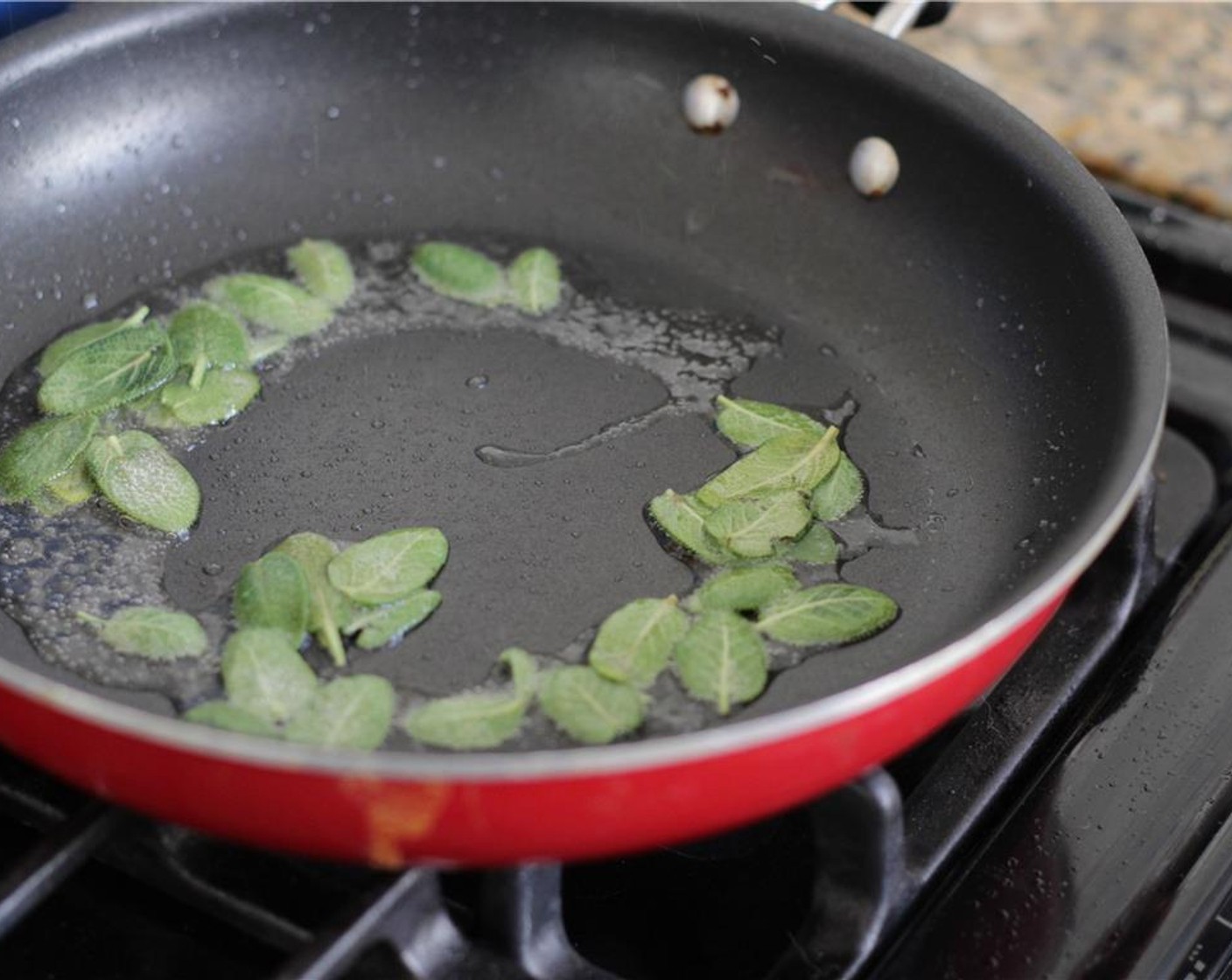 step 7 When the oil is hot, toss the sage leaves into the pan. Let the sage sizzle for about 3-4 minutes. Remove the leaves with a slotted spoon and set aside on a paper towel to drain.