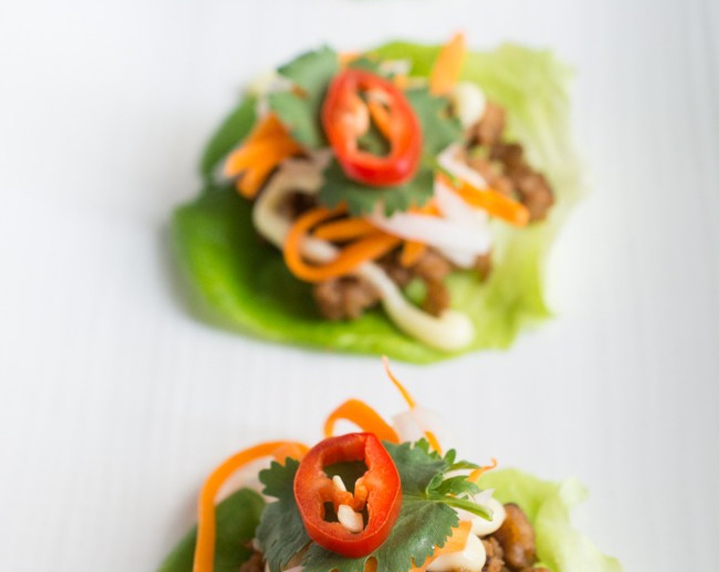 step 8 Top with pickled carrot and daikon, Fresh Cilantro (to taste), and a Red Chili Pepper (1).