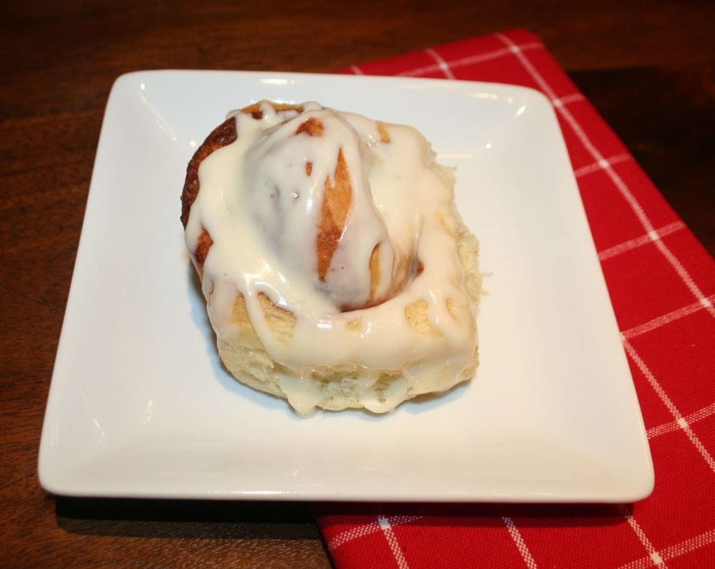 step 11 Once the cinnamon rolls are finished, glaze while they are still hot.