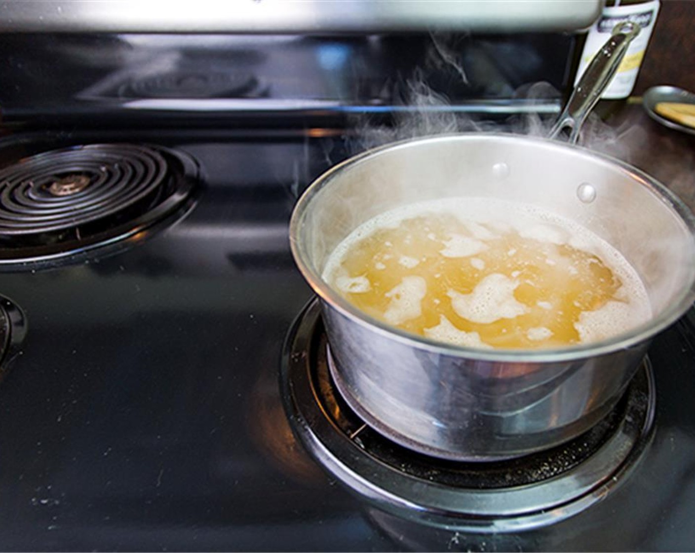 step 2 Add Wild Rice (2 cups) to a medium pan with  Chicken Broth (3 cups). Bring to boil then reduce to low and cover the pan. Cook until rice just breaks open and slightly tender about 35 minutes. Set aside.