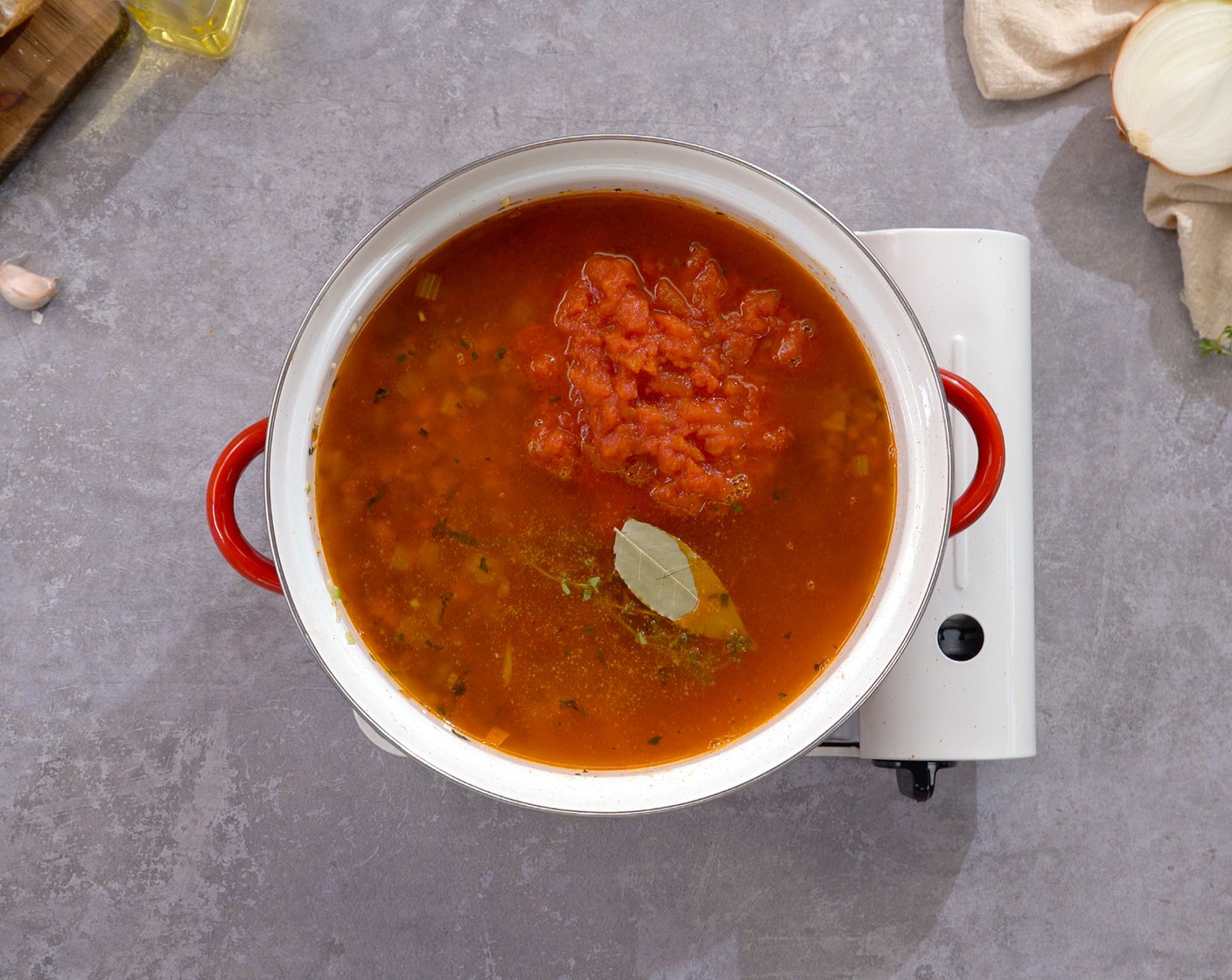 step 5 Add Diced Tomatoes (1 can), Vegetable Broth (4 cups), Fresh Thyme (1 sprig), Bay Leaf (1), and Tabasco® Original Red Pepper Sauce (1 tsp). Bring to a simmer and cook for about 10 minutes. Season with Salt (3/4 tsp) and Ground Black Pepper (1/2 tsp).