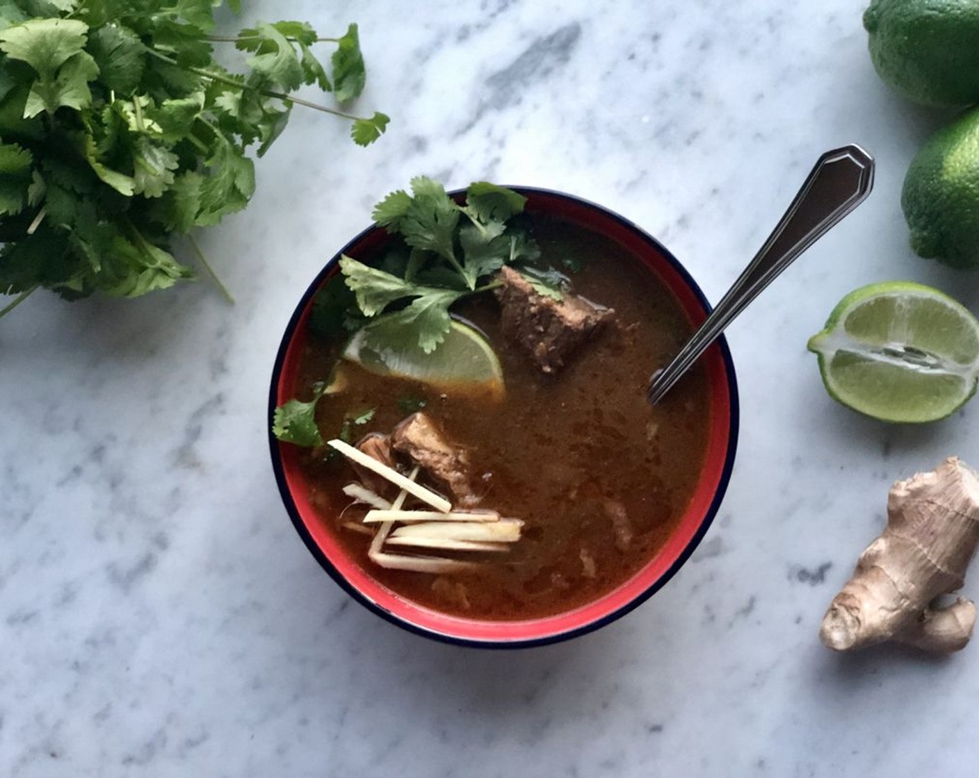 step 10 Season with salt to taste. Top each bowl with Fresh Cilantro (1 bunch), Green Chili Peppers (4), and Fresh Ginger (1 in). Serve with wedges of Limes (4) and Naans (to taste).