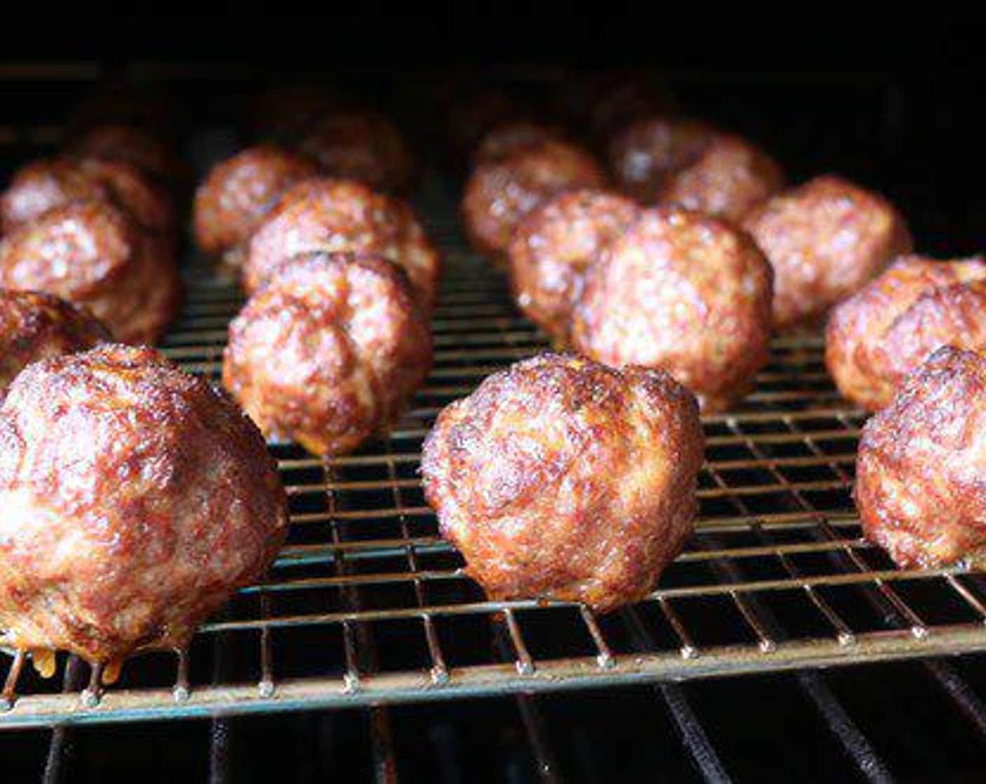 step 2 Place the meatballs on a pork rack sprayed with non-stick cooking spray. You can smoke your meatballs on any grill or smoker. You want to hold the temps at 275 degrees F (140 degrees C) with a little light smoke. Allow the meatballs to smoke for 35 - 45 minutes  - or until the meatballs hit an internal temp around 160-165 degrees Fahrenheit (71-73 degrees C).